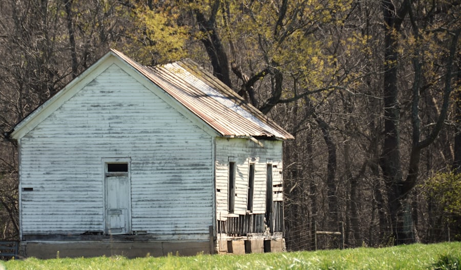 Old, slightly run-down house sitting on open land